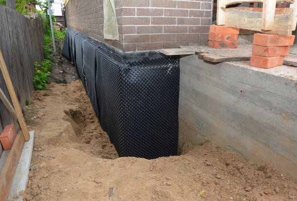 SJ Waterproofing Pros technician performing targeted Vapor Barrier Installation assessment in Fowler, MI